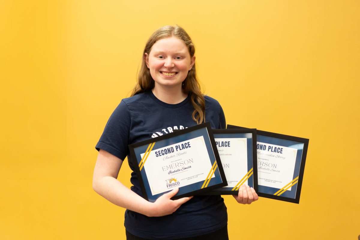 Isabelle Smith poses with all three awards