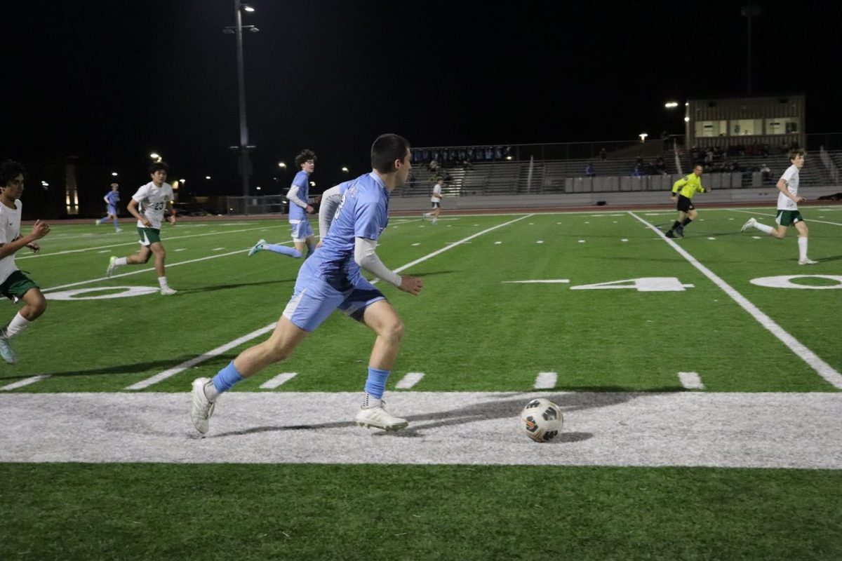 Senior Carson Watts looks for a gap to shoot the ball to provide a chance for the team to score