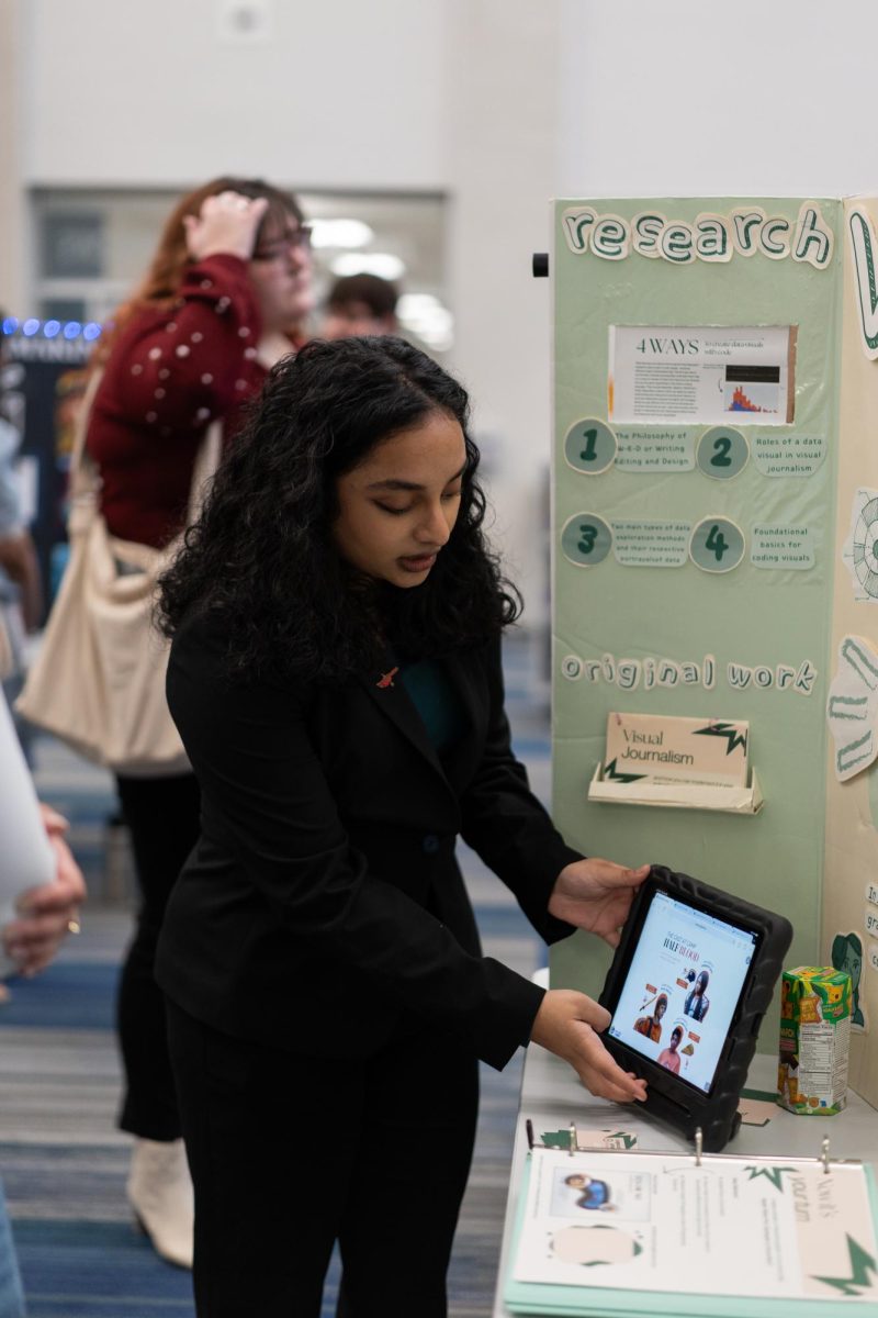 ISM 1 student Parnita Avala shares her original work surrounding Visual Journalism in the gallery walk portion of the ISM Final presentation night. “The final presentation night was so stressful but also amazing, I loved talking to others about my passion,” Avala said. 