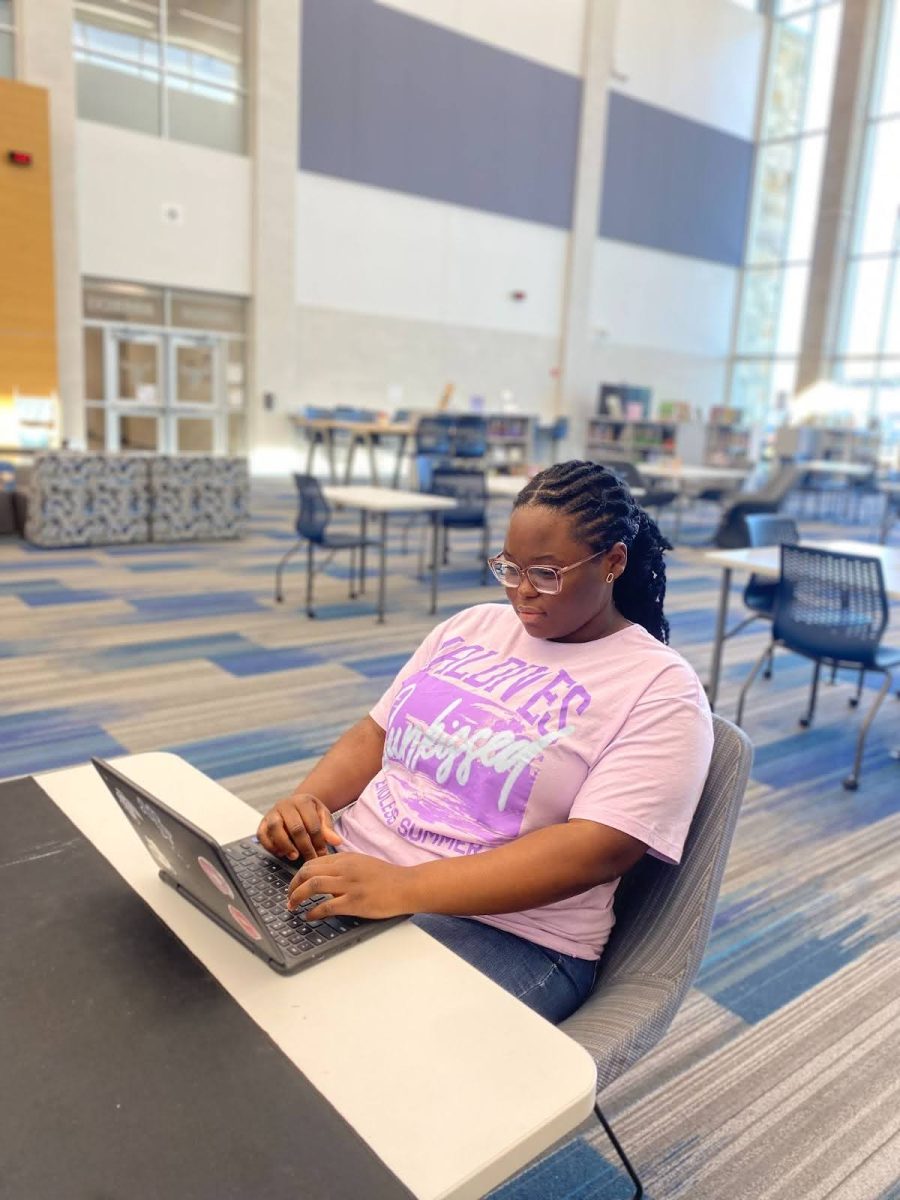 Ayomikum Bamgbala, 12, utilizes the library as a quiet space to study and complete assignments.