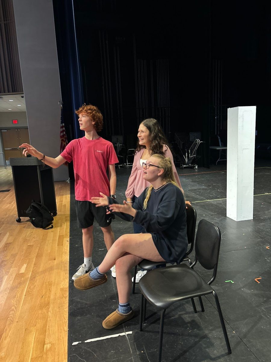 Creative leads William Webster, 10, Lauren Bazan, 12, and Olivia Northcutt, 11, give critiques on a duet number for the showcase.