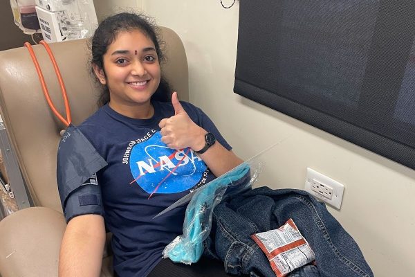 Senior Srinidhi Marrivada prepares to donate blood in a Carter BloodCare bus.