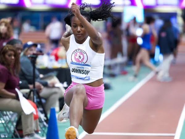 Johnson is focused during the long jump event as all eyes are set on her. 