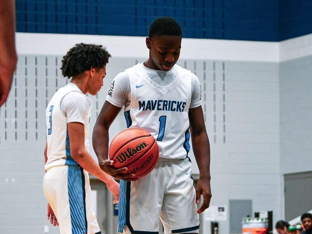 Jordan Hopkins, 9, lines up his feet to shoot free throws after a foul committed by the opposing team. 
