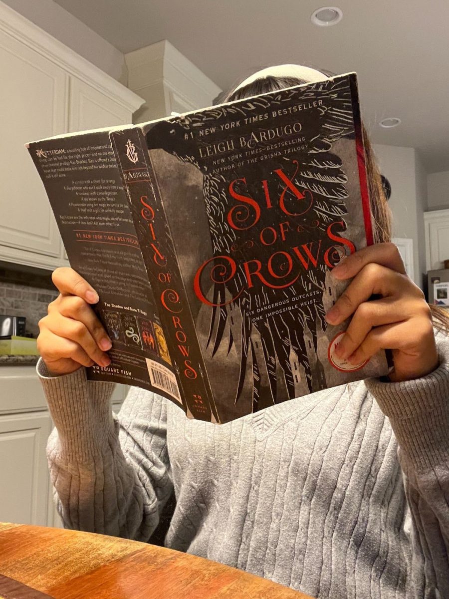 Pakapon Gibbons (10) reading Bardugo’s “Six of Crows,” which won the Best International Novel for Germany Fantasy Awards in 2018.