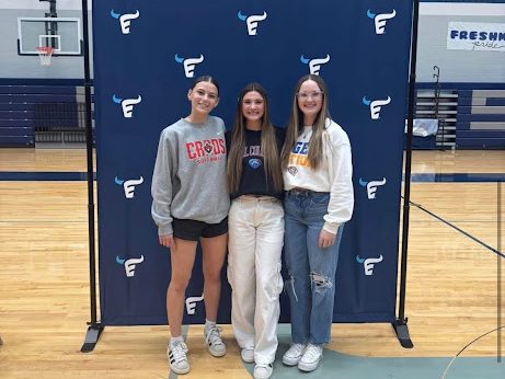 Addison Hudnall, 12, Madison Fletcher, 12, and Amilee Stapp, 12, pose as Emerson's first softball signees.