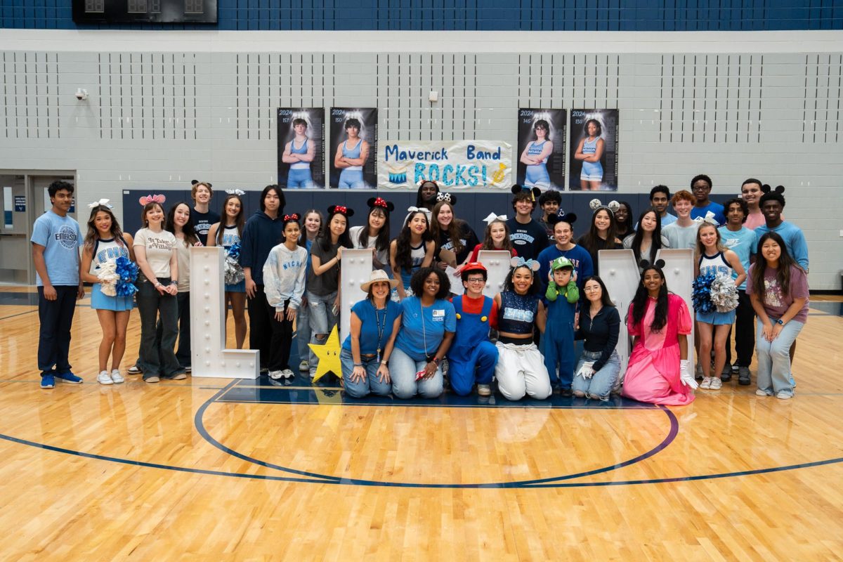Students from Maverick Leadership, cheer and other student organizations pose with Liam after an exciting pep rally.