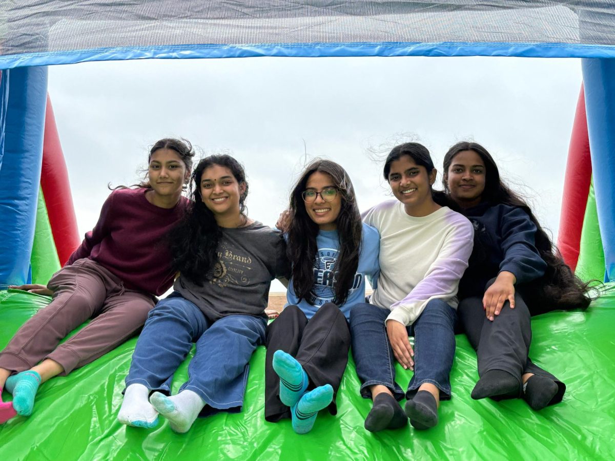 Anisha Reddipalli, 12, Srinidhi Marrivada, 12, Pakhee Verma, 12, Rida Faiz, 12, and Smarani Kamishetty, 12, go down the bouncy slide together.