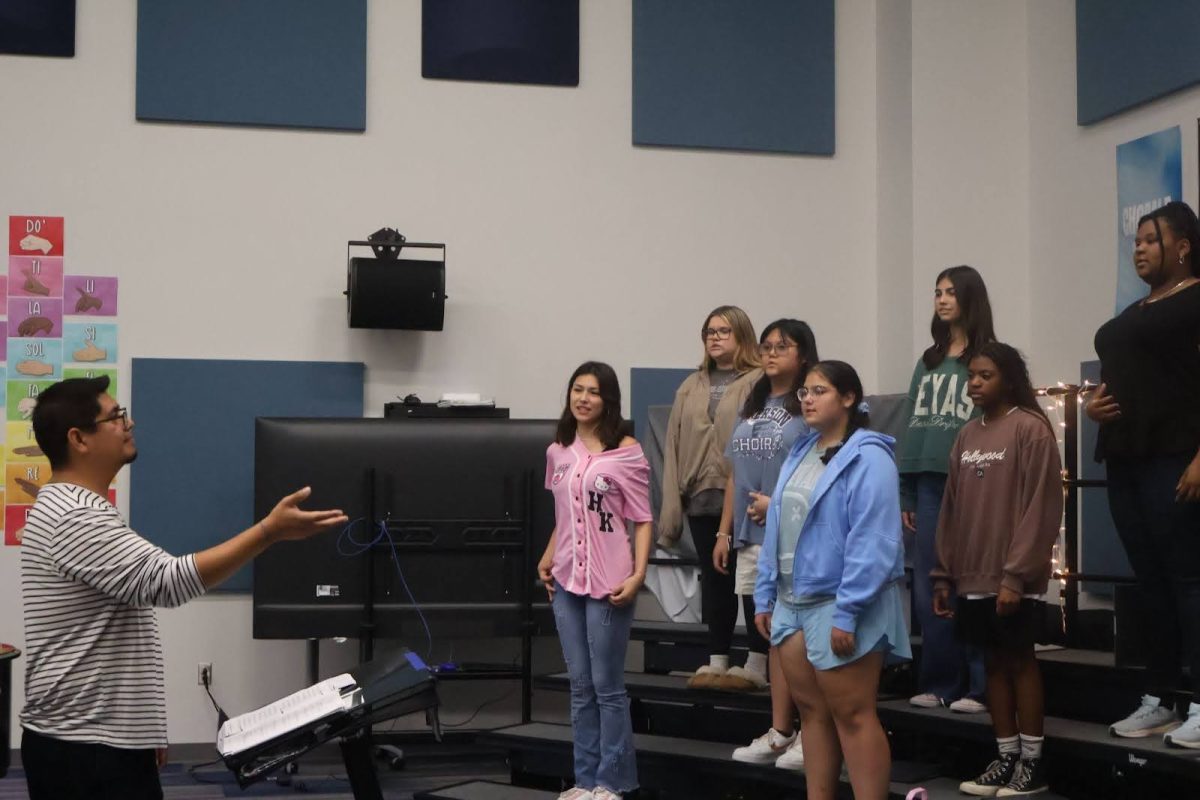 Lopez conducts the Treble Choir.