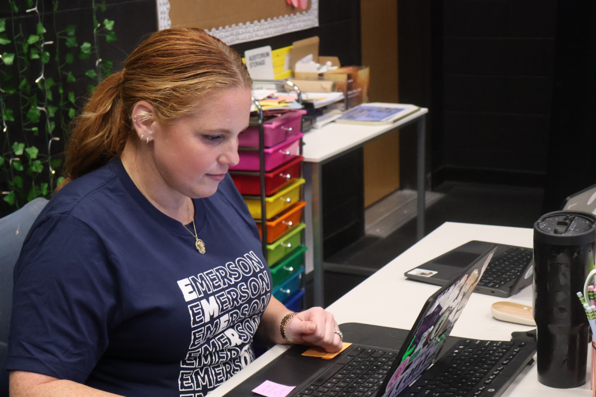 Elizabeth Rotan enters audition information into the new Band system. 
