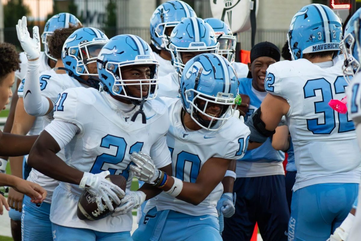 Spencer Carolina, 11, and Isaiah Williams, 9, celebrate after a successful play against Walnut Grove.