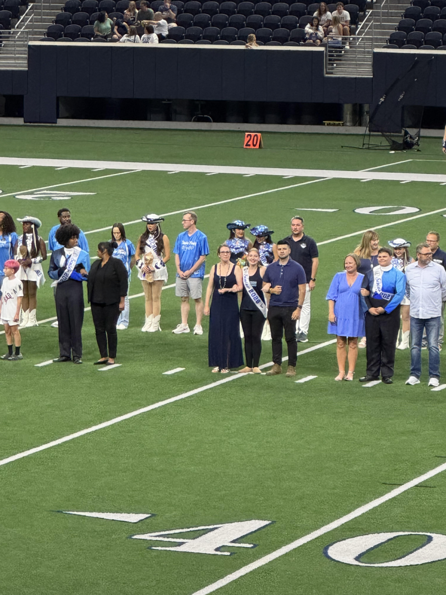 Audrey Hingst, 12, and her parents walking her down the field. (Austin Hingst)