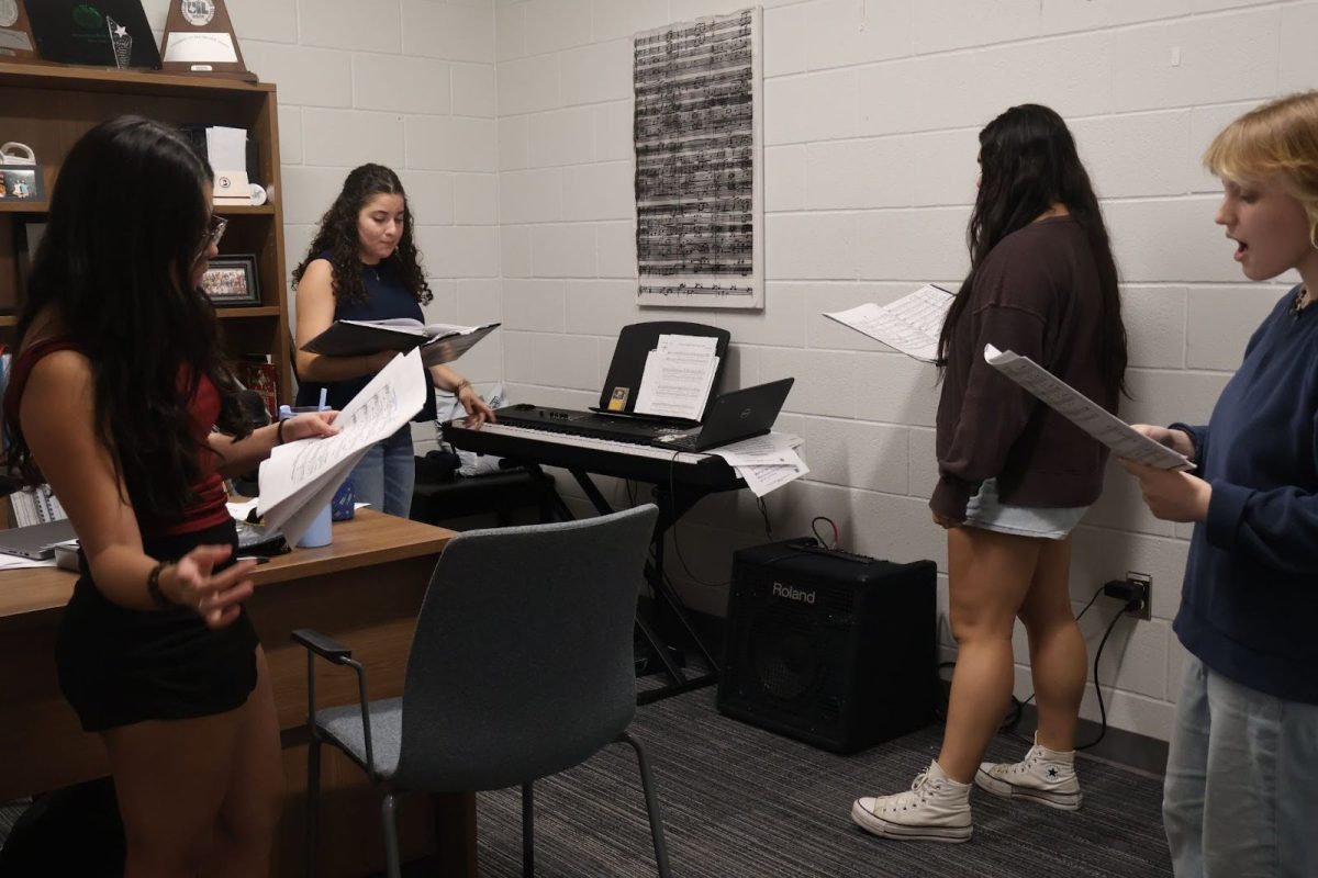 Maya Richa 12, Jacqueline Ramirez 12, Georgia Bell 12 and Carly Savois 11 work together to learn their songs for TMEA.