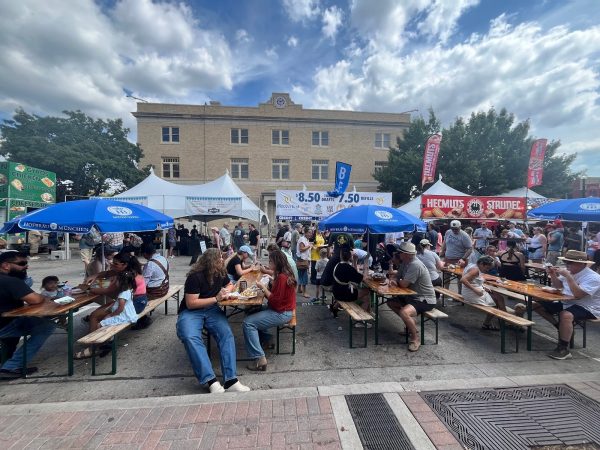 Crowd of people eating at Oktoberfest.