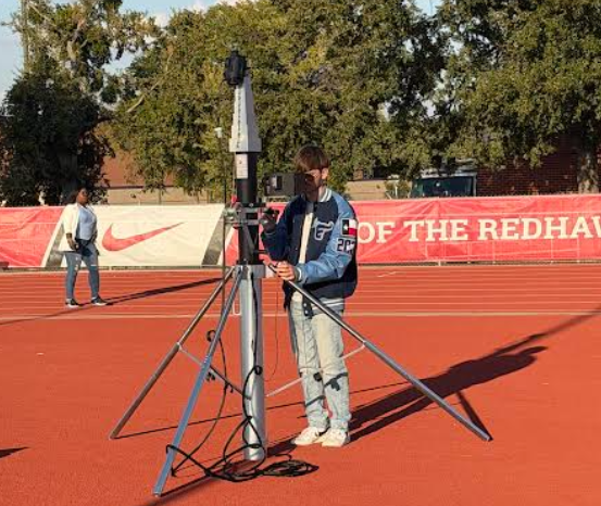 Pantuso sets up the telescope to film another game for the Emerson football team. (Billy Pantuso)