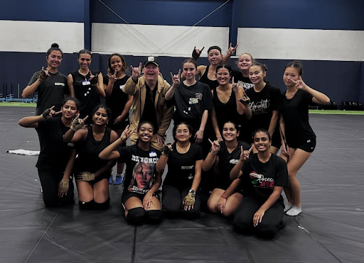 Varsity Winter Guard with their stage camp designer (@ehsfriscoguard on Instagram)

