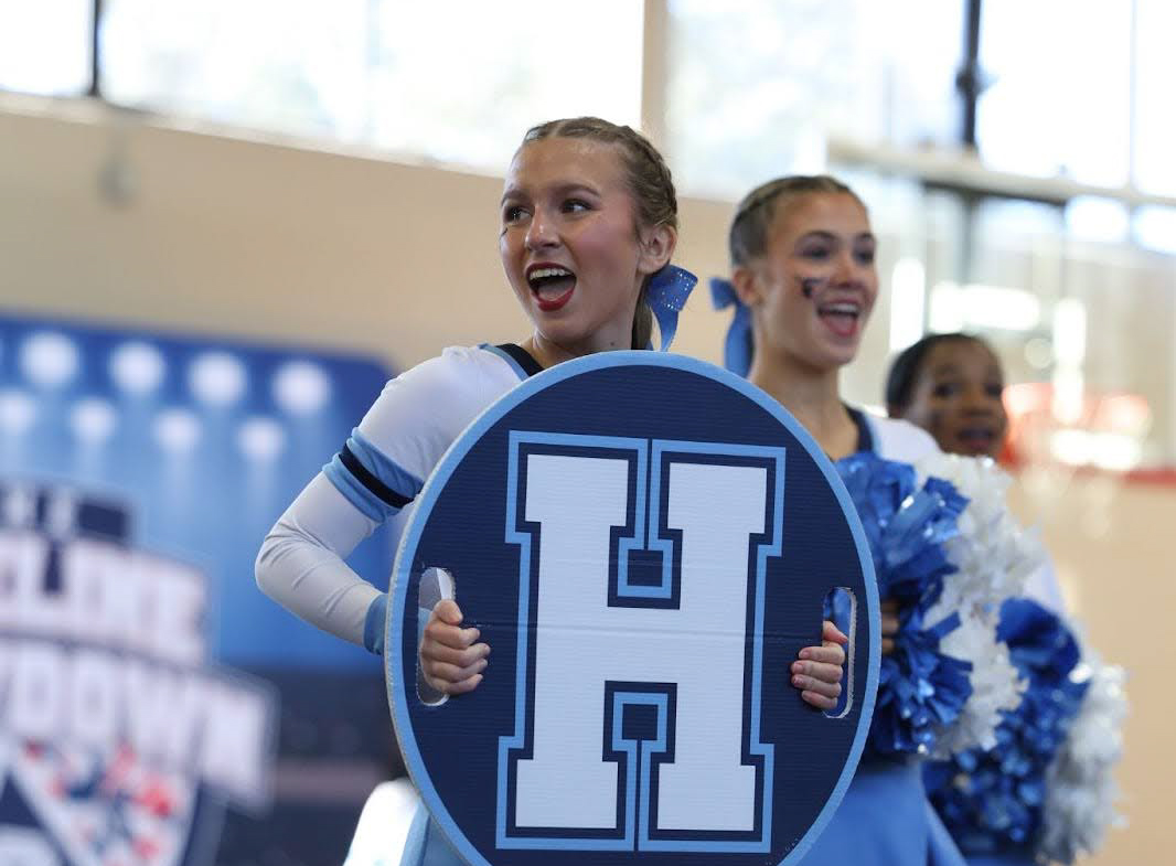 Emma Heinicke performing at their showoff prior to the competition (Express Cheer)
