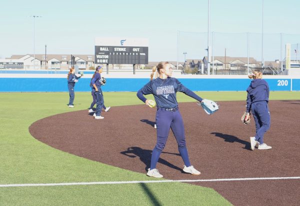 Savanna Carleton, 11, warms up with her team so everyone is ready for their scrimmage. (Emily Clemens)