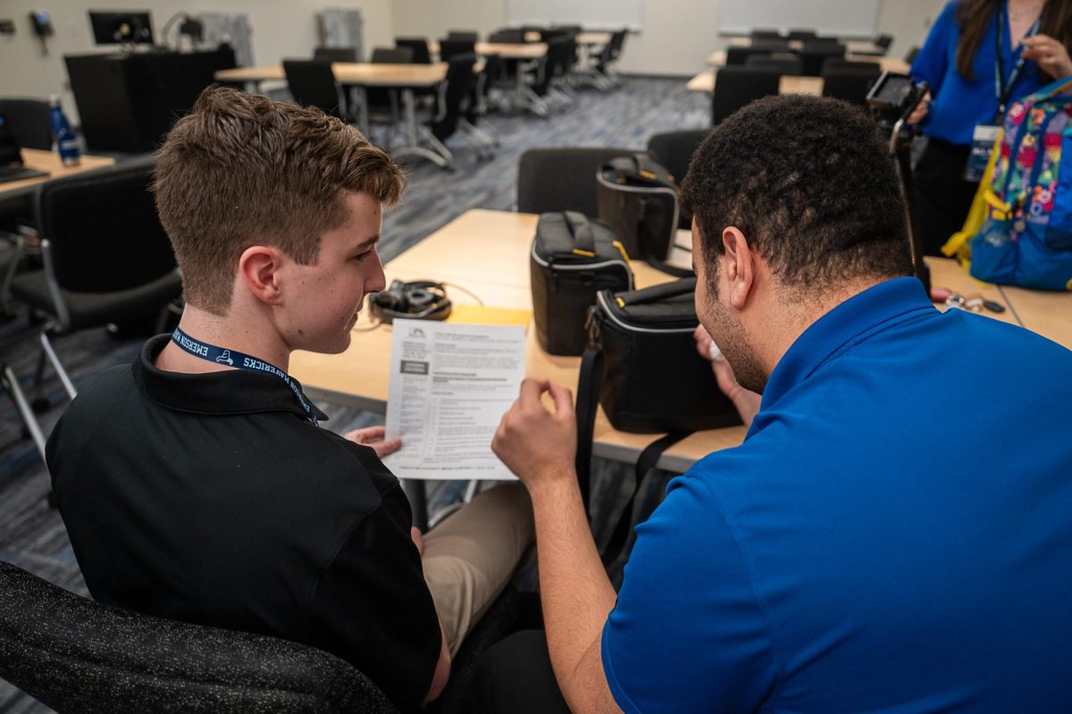 Holland and White read the prompt and plan their segment for the on-site General News Package competition. 