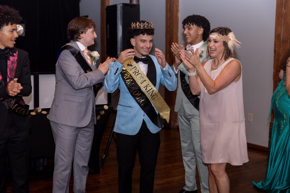John Pacheco, 12, celebrates after he is crowned Prom King.  (Gary Allyn)
