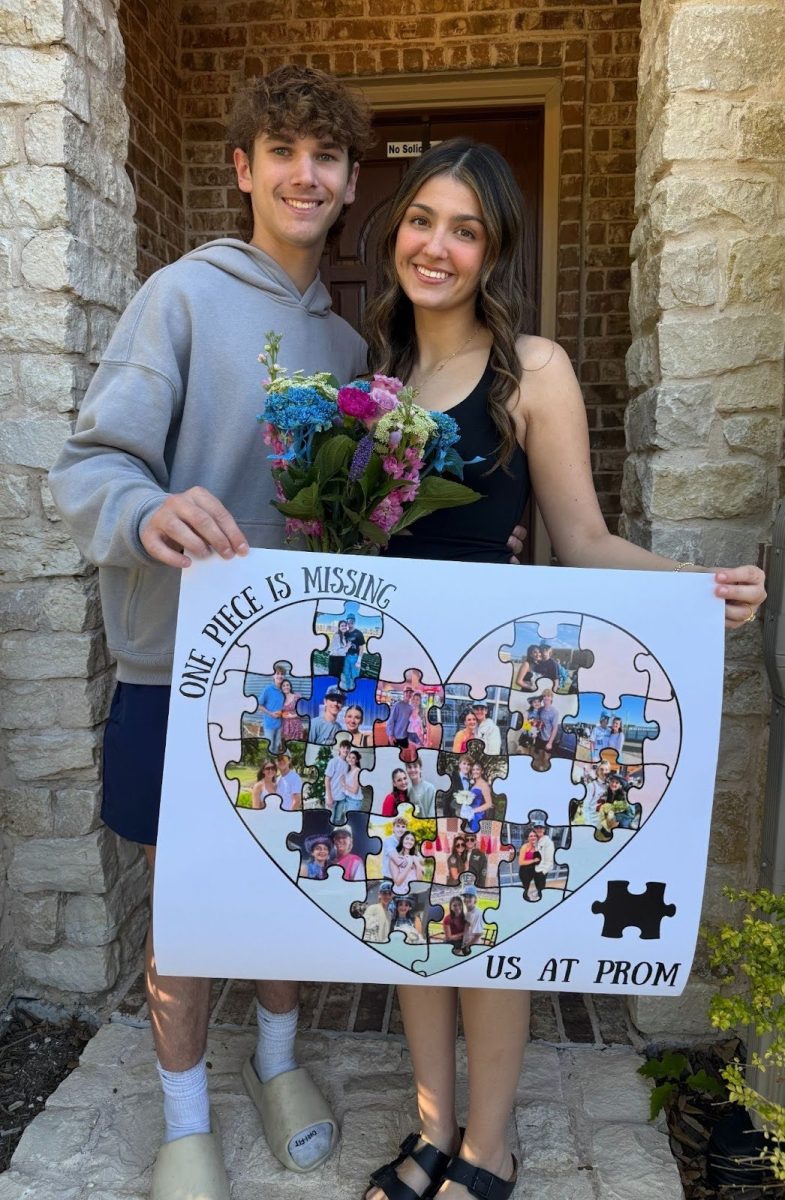 Preston Holland, 12, asks his girlfriend Riley Hazelwood, 12, to prom with his puzzle proposal.
