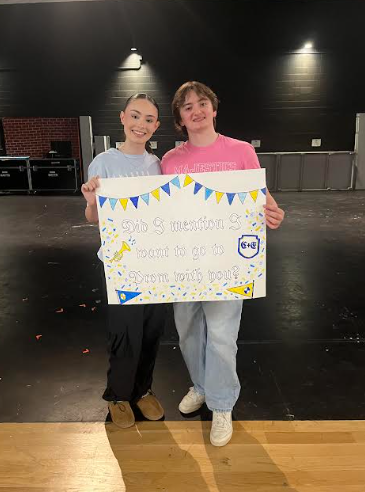 Easton Quave, 12, asks his girlfriend Claire Rozewicz, 12, to prom with his Descendants themed promposal.
